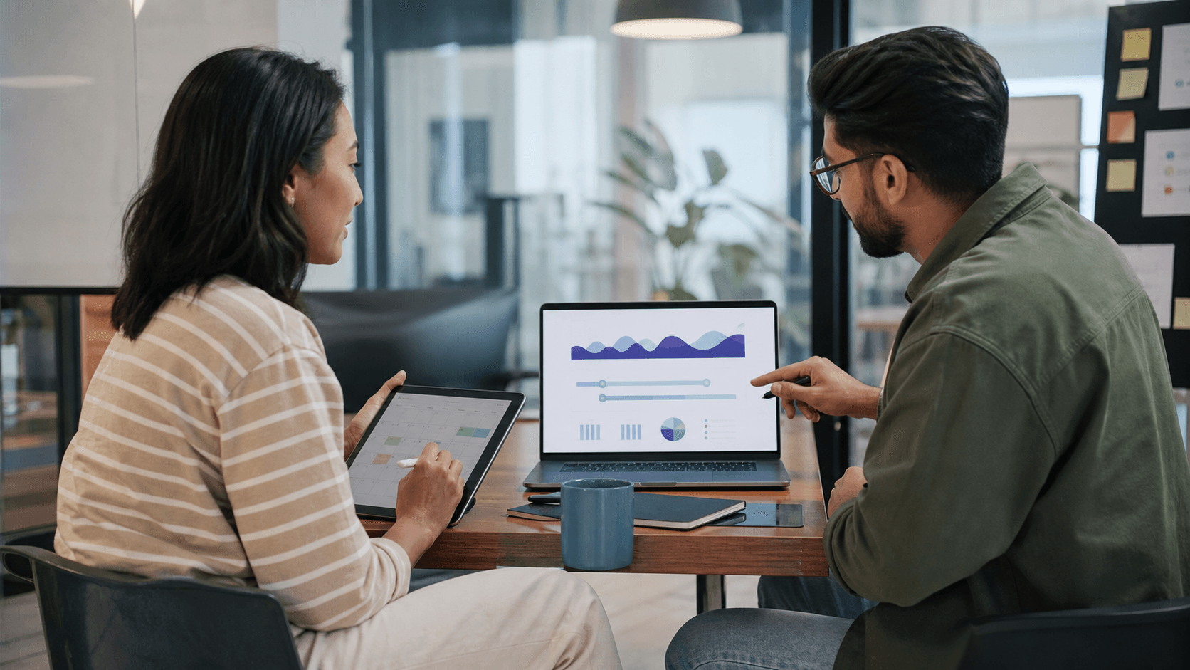 Hero image of marketers comparing attribution-window timelines and abstract Meta Ads performance charts on a laptop.