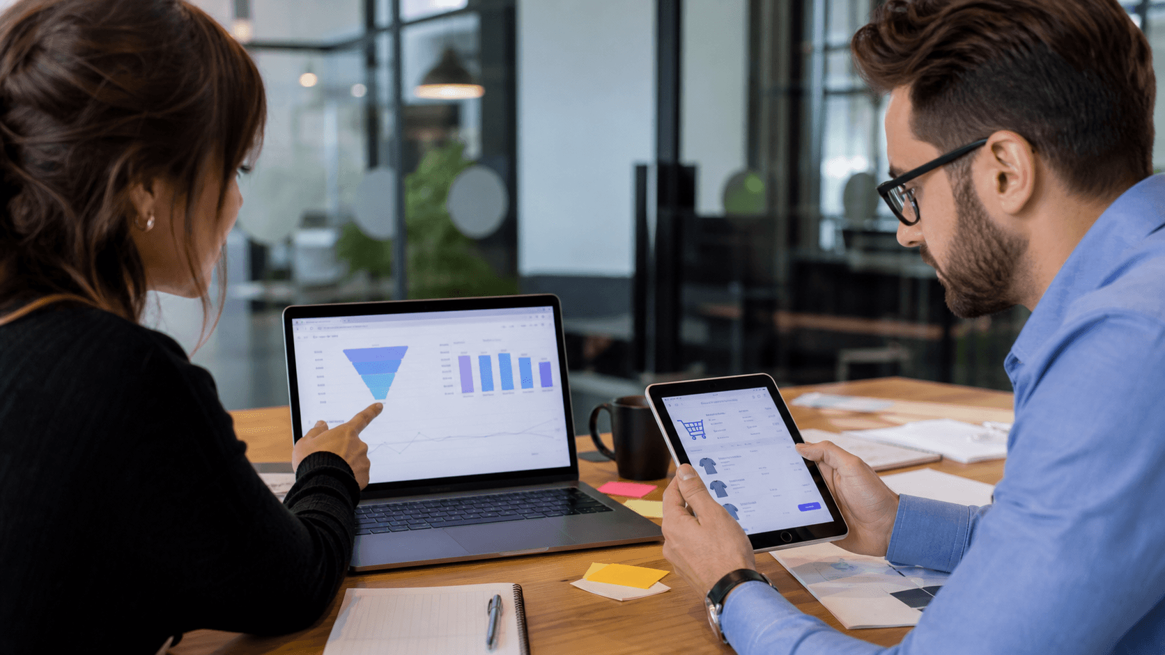 Hero image of an ecommerce marketer and operator reviewing checkout funnel drop-off from Meta Ads add-to-carts to purchases.