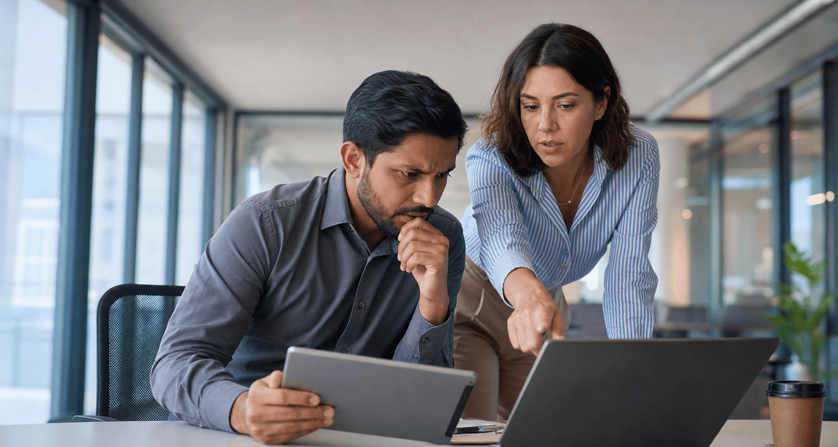 Hero image of marketers reviewing a laptop and tablet to diagnose Meta Ads campaigns with high CTR but low link-click quality.
